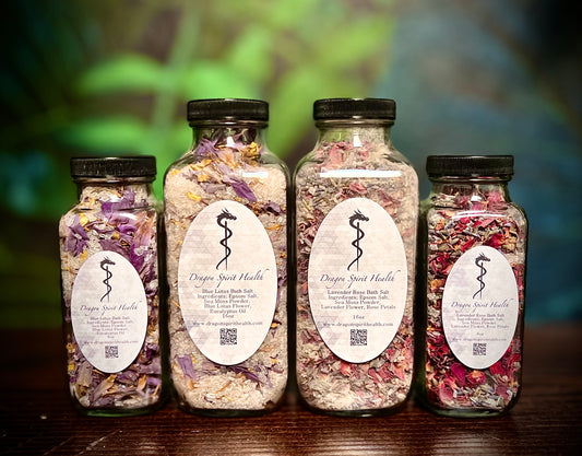collection of Sea Moss Bath Salts in multiple sized jars on a wooden table