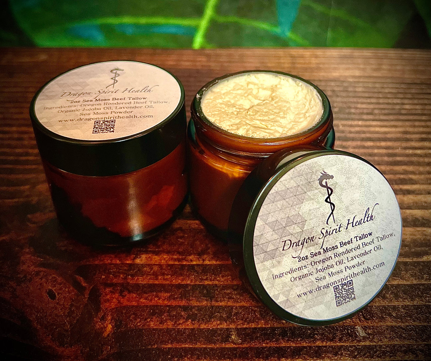 Jars of Sea Moss Face Beef Tallow on a wooden table
