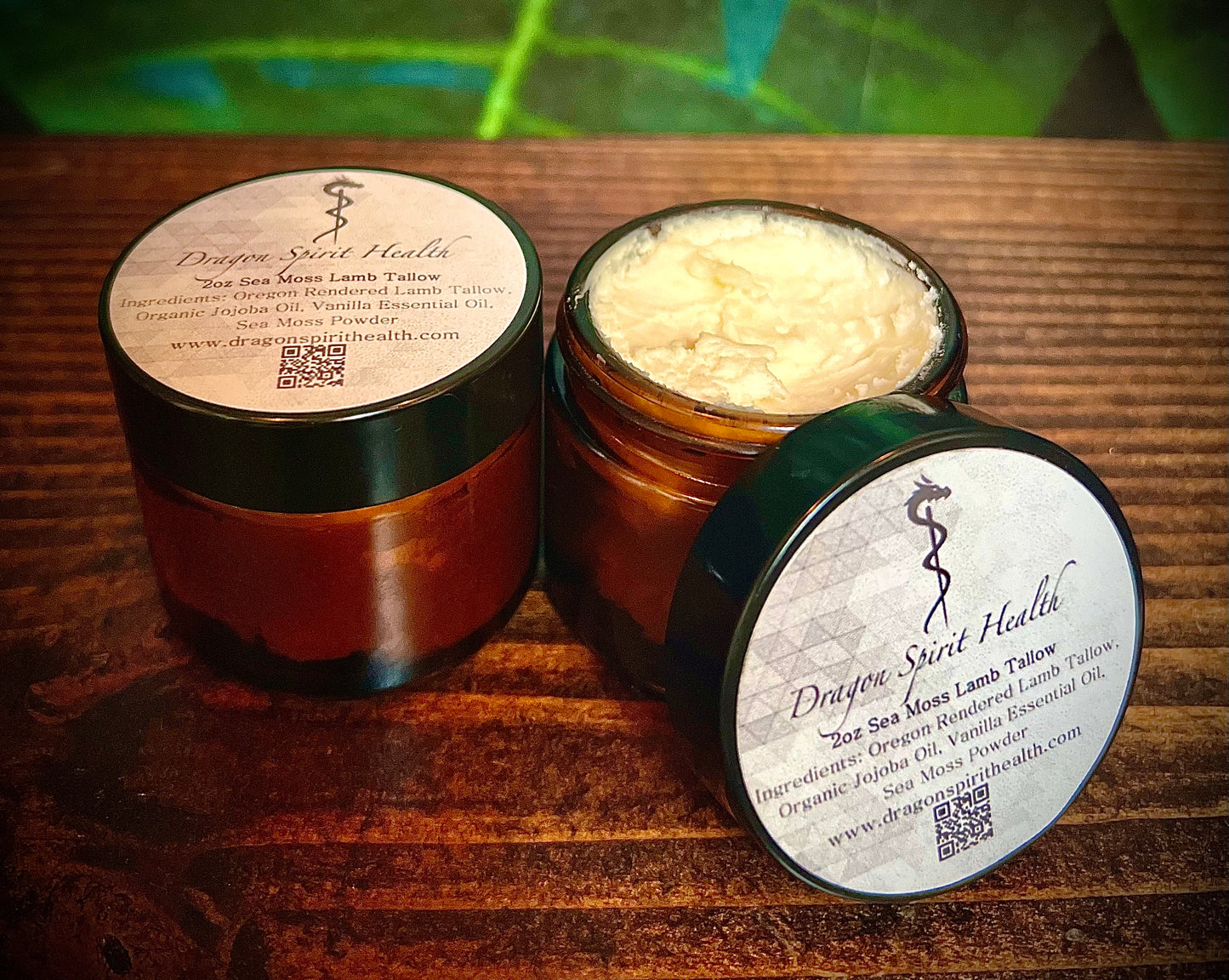 Jars of all natural Sea Moss Face Lamb Tallow on a wooden table
