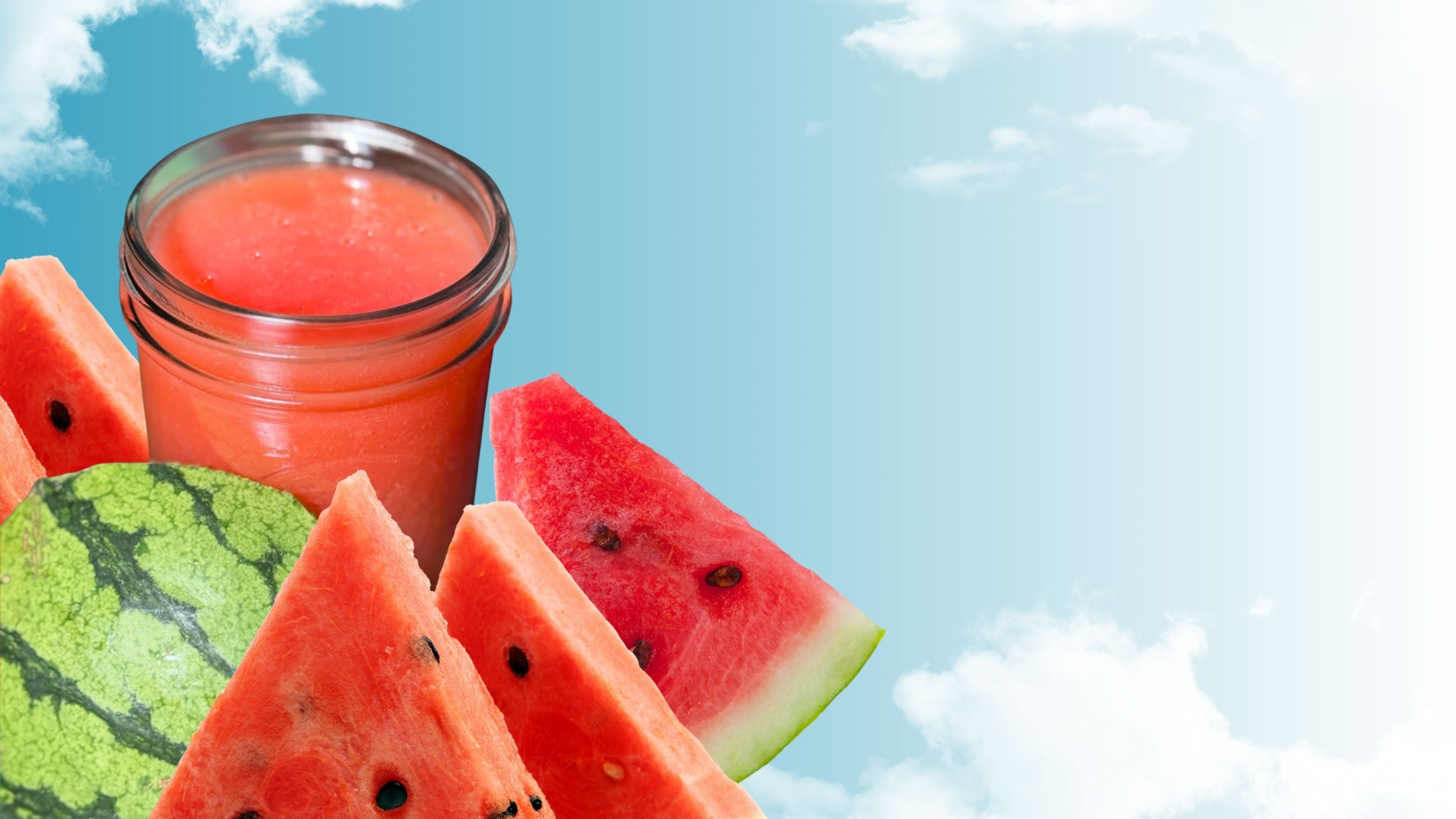 Jar of watermelon juice with sliced watermelons against a blue sky background
