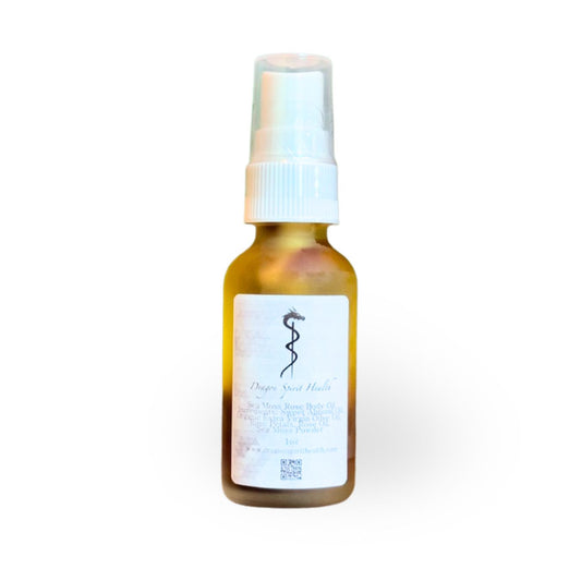 Small amber glass bottle with a white spray cap on a white background